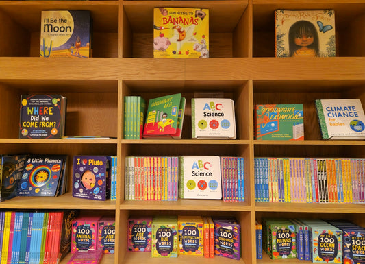 a book shelf filled with lots of children's books